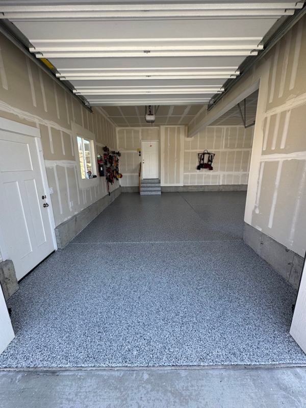 Blue gray flake floor in a one car garage with flake on the entry steps