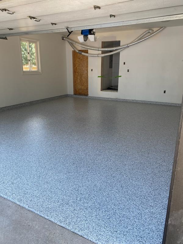 Blue gray flake garage floor in a finished two car garage