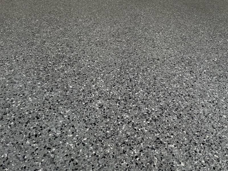 Close up of gray and black flake coating