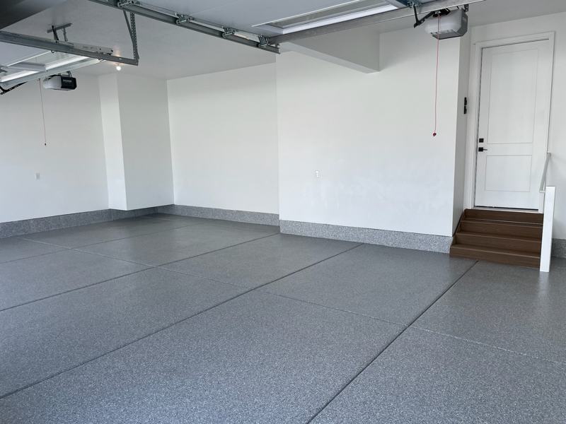 Gray flake garage floor with a flake baseboard and white walls