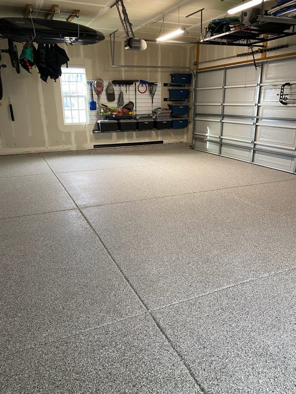 Flake garage floor in a garage with slatwall storage